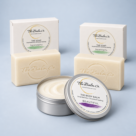 The Clean + Care Body Set featuring two Serendipity soaps and one open 4 oz The Body Balm tin in Beautiful scent on a soft blue background.